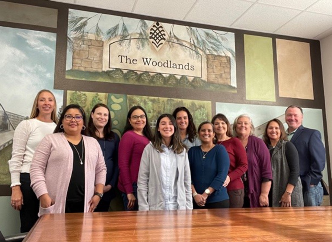 About Our Agency - Kimball Insurance Team Standing Together at Their Woodlands Office